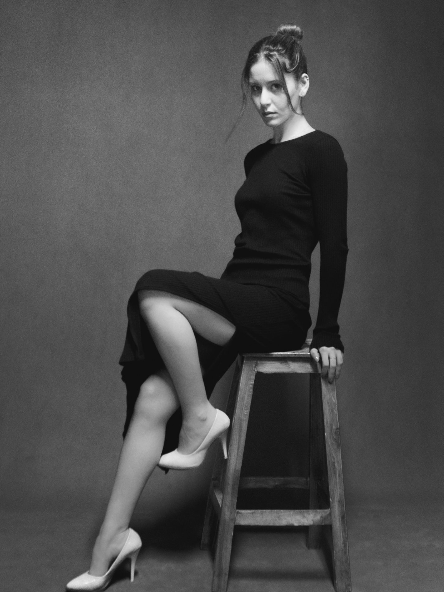 Black and white minimal fashion portrait on stool