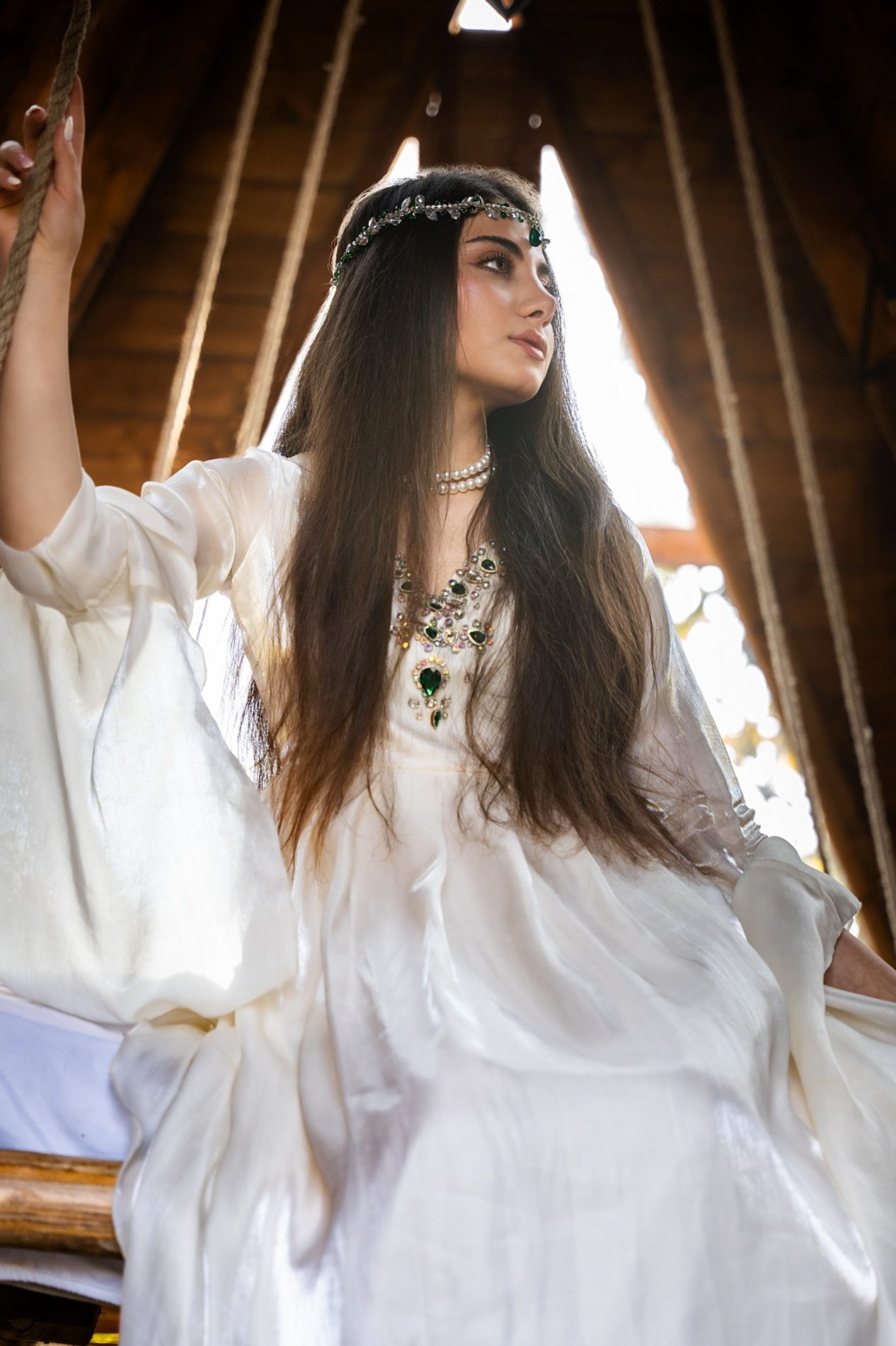 White dress fashion portrait in wooden cabin